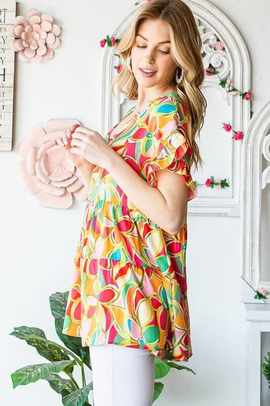 All In Fun Graphic Floral Babydoll Top in Coral - Curvy
