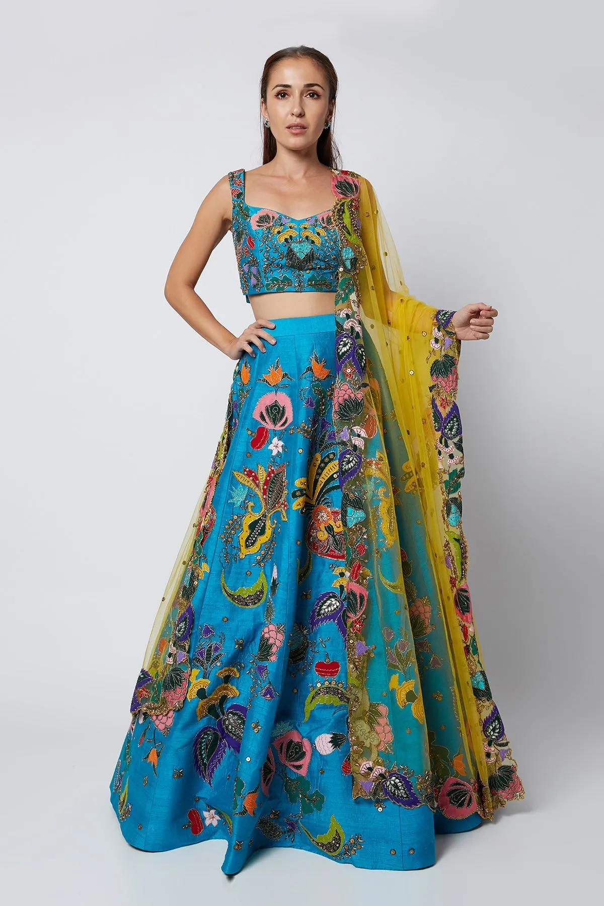 Cyan Blue Nadenka Raw Silk Appliquéd And Embellished Lehenga With Blouse And Cutwork Tulle Dupatta