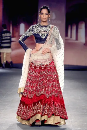 Indigo crop blouse with red anarkali lehenga