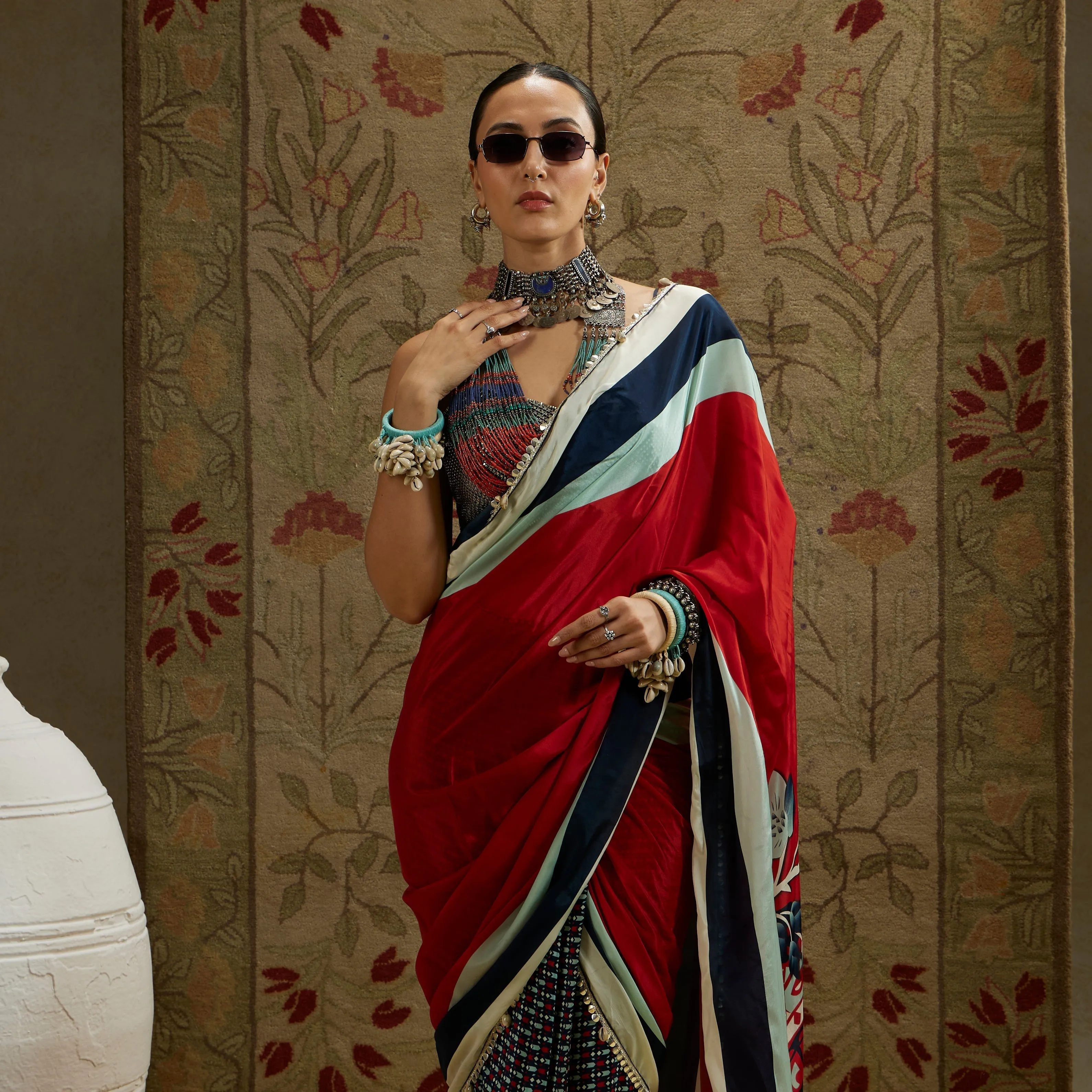 RED MASK PRINT CASCADE SAREE WITH METAL EMBELLISHED BUSTIER